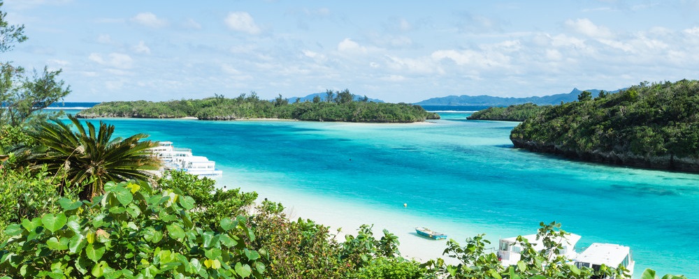 Clear blue water and rocks islands in a coral lagoon, Kabira Bay Beach, Ishigaki Island of the Yaeyama Islands, Okinawa, Japan