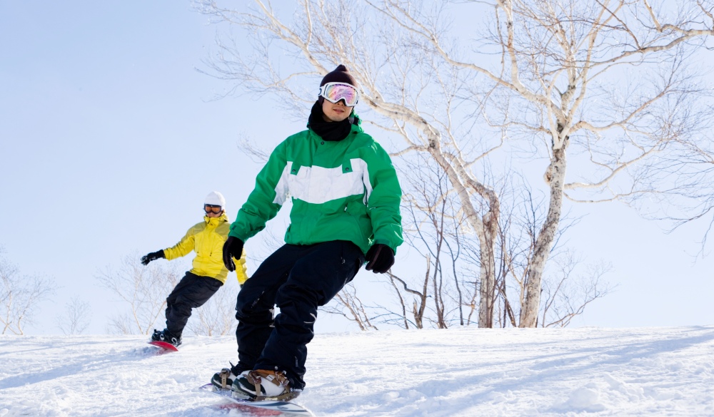 Two men snowboarding