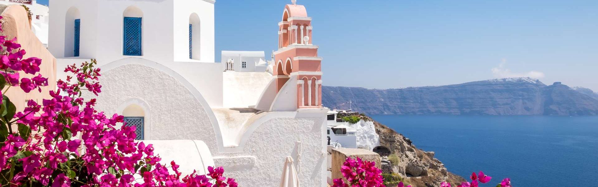 Santorini, Greece Cyclades architecture hotels houses over the caldera in  Oia santorini greek islands against mediterranean sea view with mountains  by