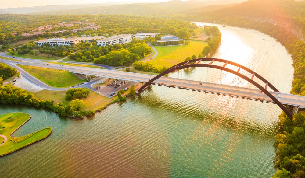 Pennybacker 360 bridge, Colorado River, Austin Texas, aerial panorama, motorcycle rides road trip