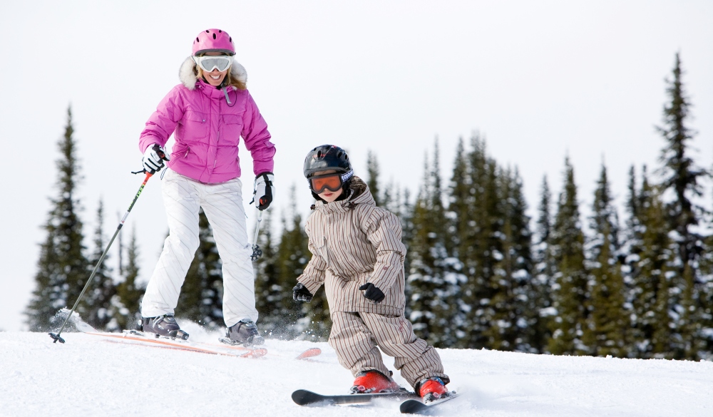 Mother and child skiing